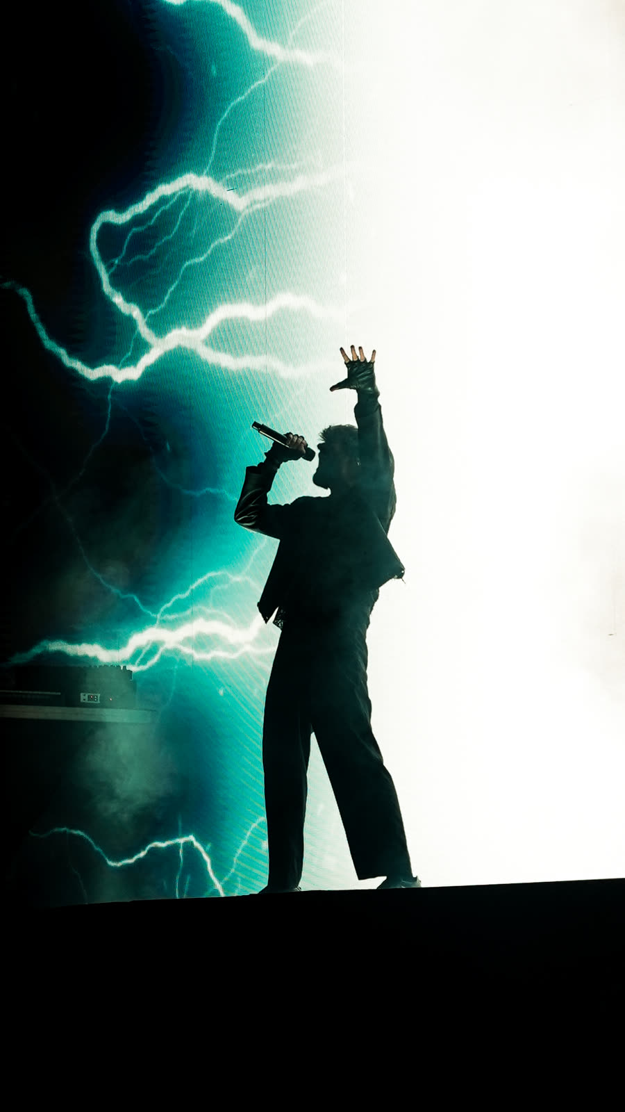 Silhouette against a wall of light