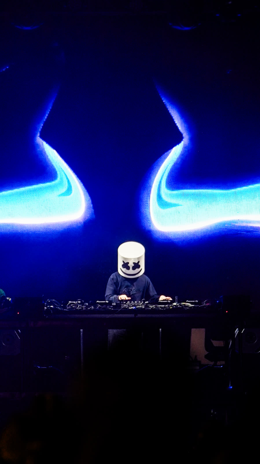 DJ set under stage lights