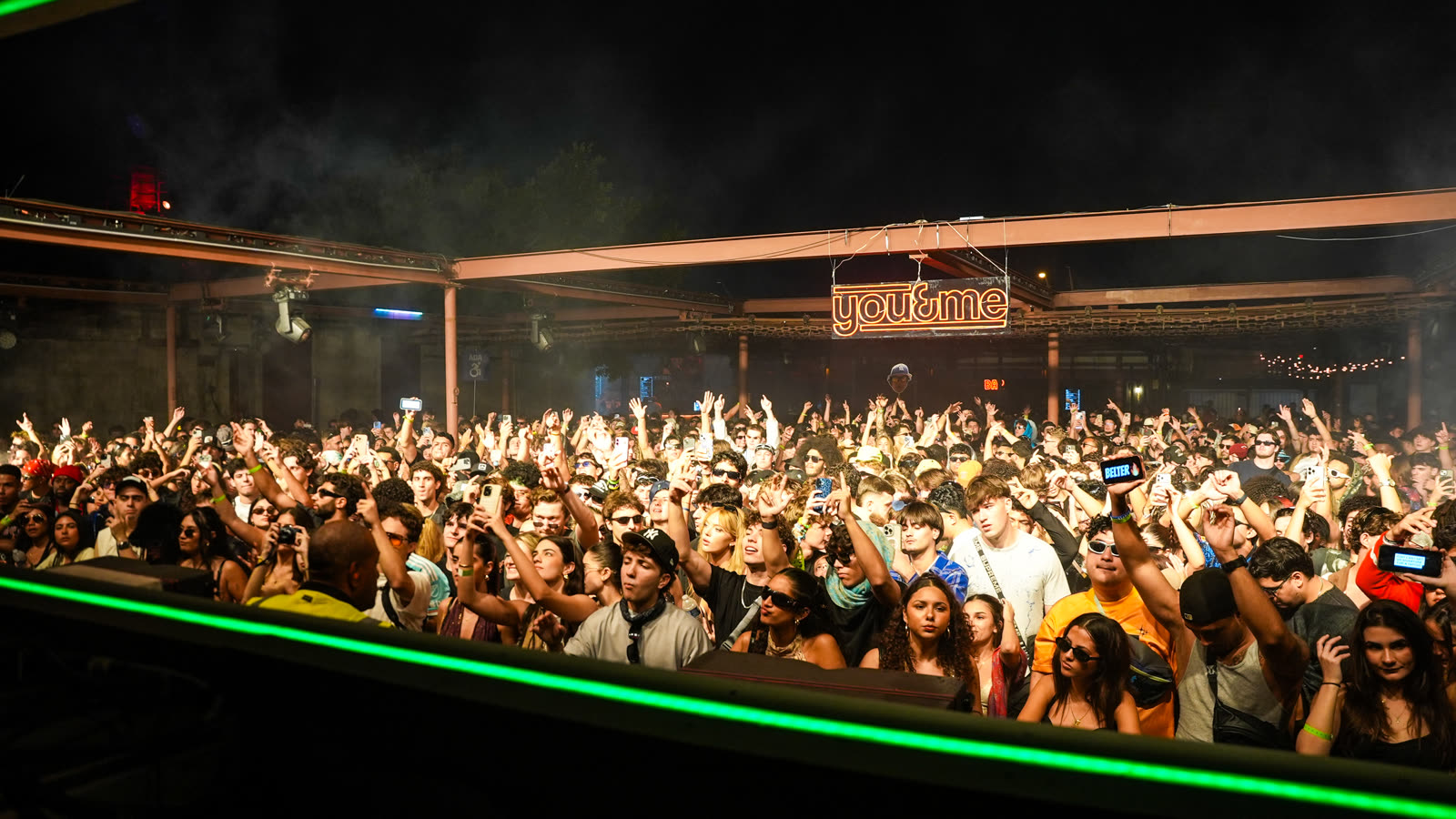Crowd under green lasers