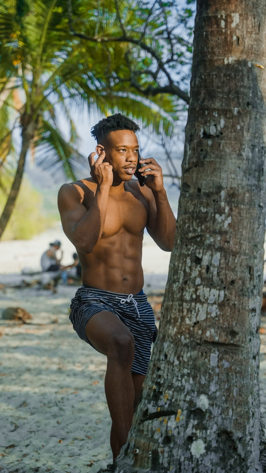 Lifestyle portrait by a palm tree